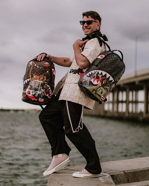 SPRAYGROUND 910B7790NSZ-1 MADAGASCAR ESCAPE TO THE CITY BACKPACK MADAGASCAR NYC Reveal